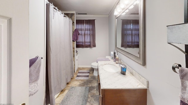 bathroom featuring vanity, crown molding, tile patterned flooring, and toilet