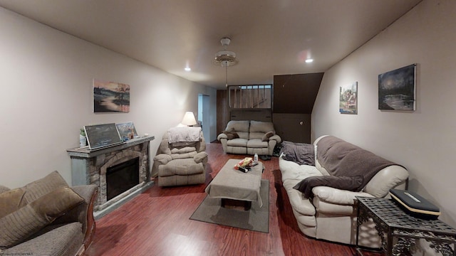 living room featuring dark hardwood / wood-style floors and a fireplace