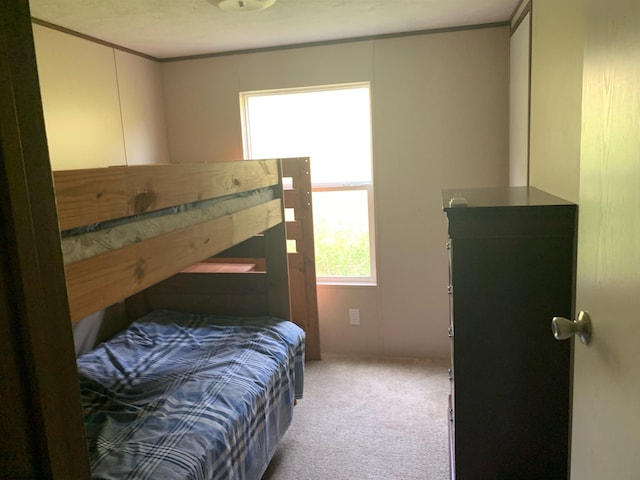 bedroom with carpet flooring and ornamental molding