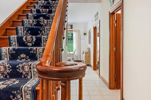 staircase with tile patterned floors