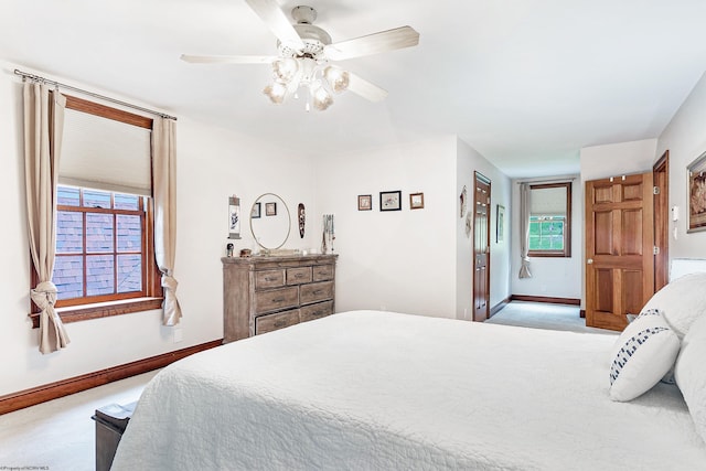 bedroom with light carpet and ceiling fan