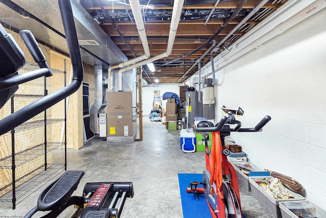 basement featuring water heater and heating unit