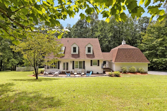 view of front of property with a front lawn and a patio