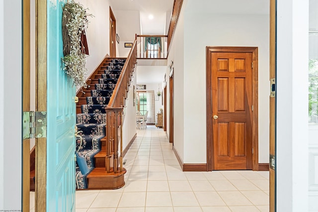 corridor featuring light tile patterned floors