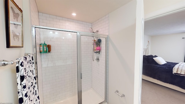 bathroom with a shower with shower door