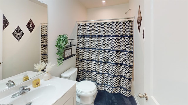 bathroom with vanity and toilet