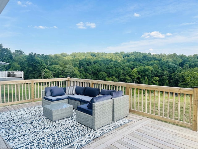 wooden terrace featuring an outdoor hangout area