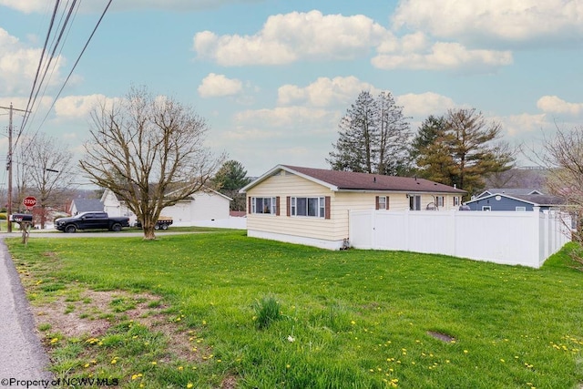 view of home's exterior featuring a yard