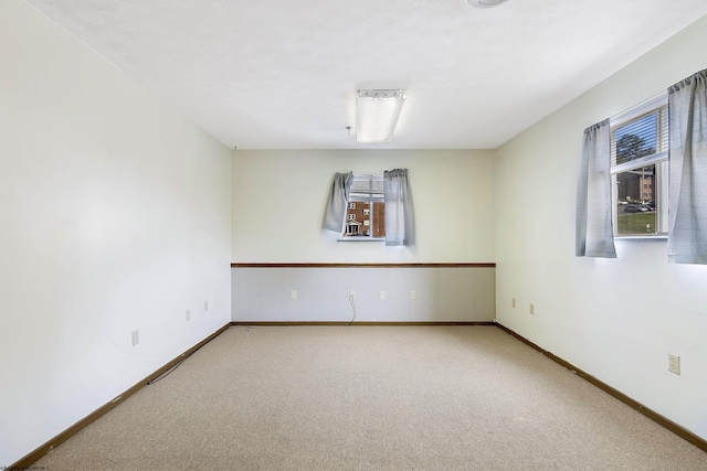 unfurnished room featuring carpet flooring