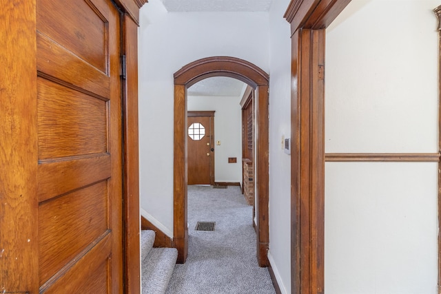 corridor featuring carpet flooring