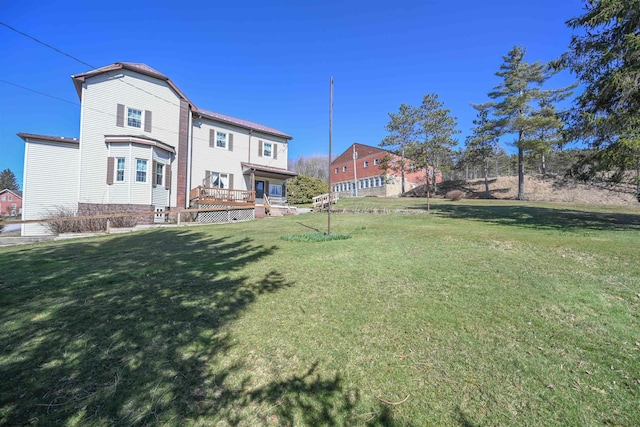 view of yard with a wooden deck