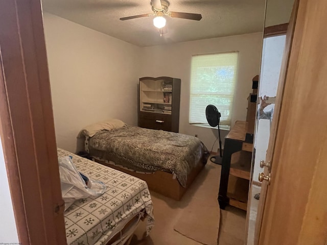 bedroom featuring carpet floors and a ceiling fan