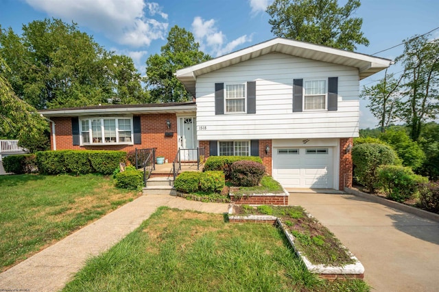 split level home with a garage and a front lawn