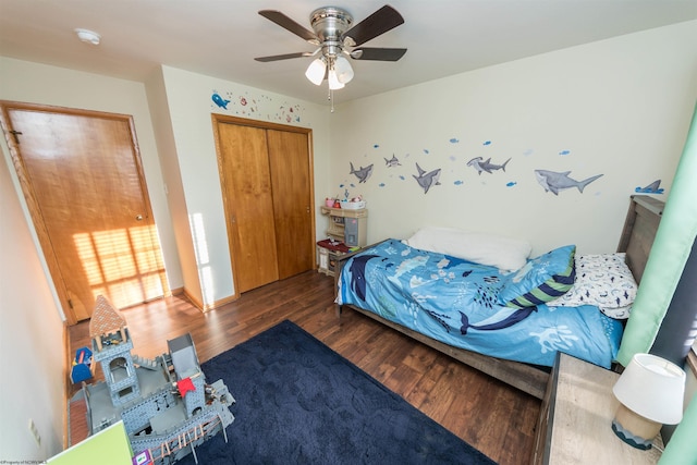 bedroom with a closet, ceiling fan, and dark hardwood / wood-style floors