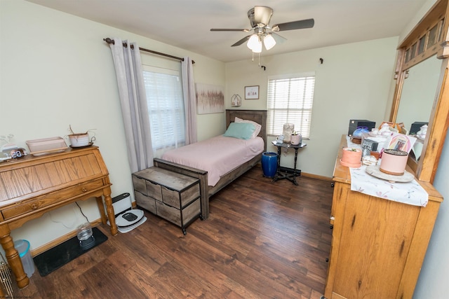 bedroom with dark wood-type flooring and ceiling fan