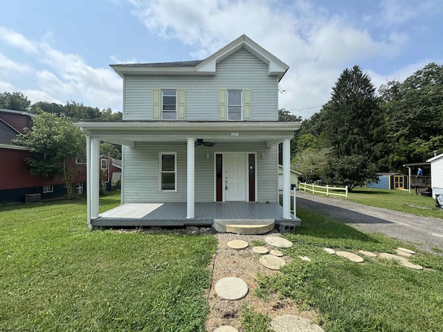 view of front of house featuring a porch and a front lawn