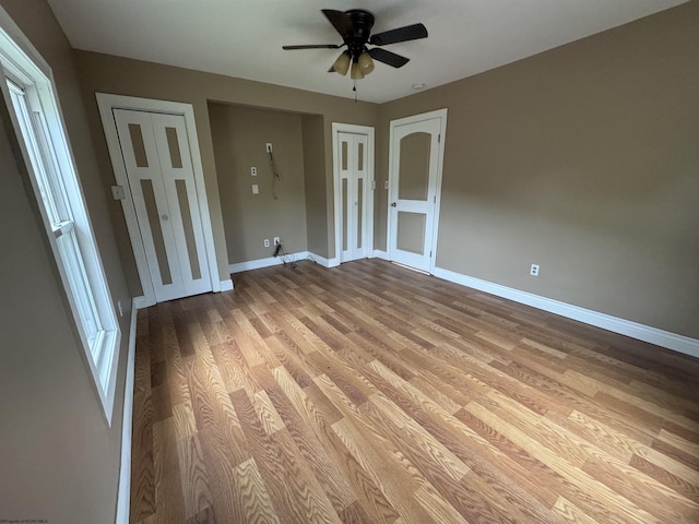 spare room featuring ceiling fan and light hardwood / wood-style floors