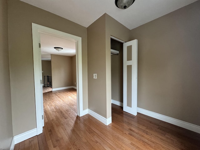 interior space with a closet and light hardwood / wood-style flooring