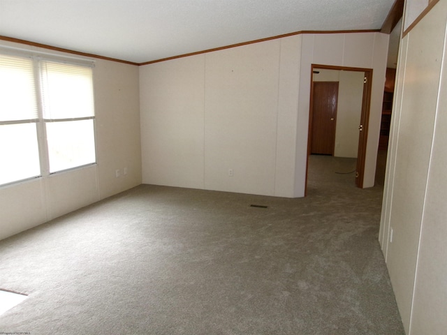 carpeted empty room with ornamental molding