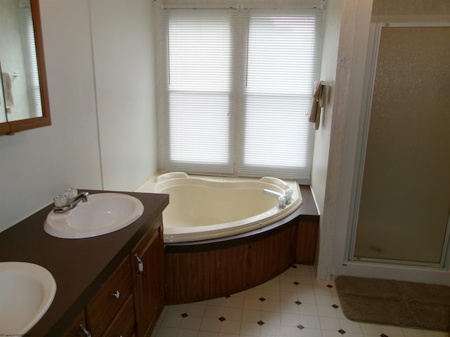 bathroom with vanity and plus walk in shower