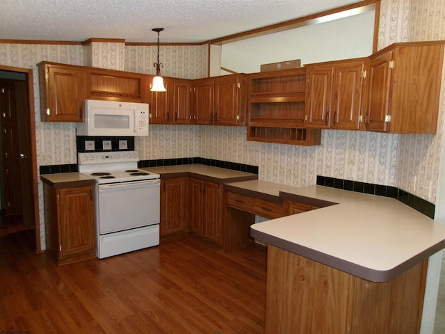 kitchen featuring dark wood-type flooring, decorative light fixtures, a textured ceiling, kitchen peninsula, and white appliances