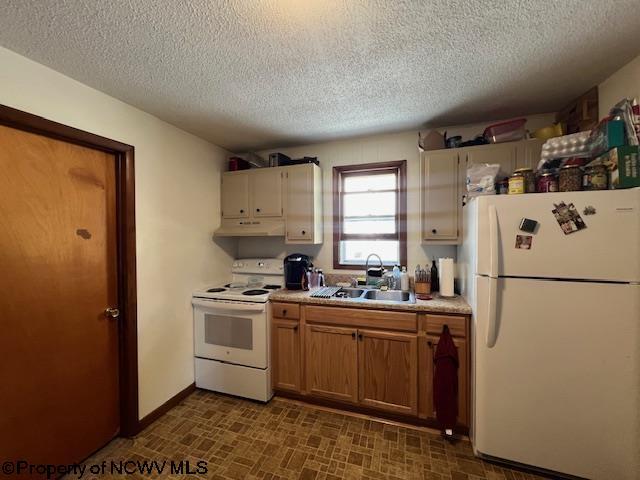 kitchen featuring under cabinet range hood, white appliances, a sink, light countertops, and brown cabinetry