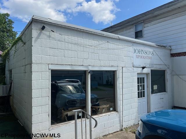 view of home's exterior featuring concrete block siding