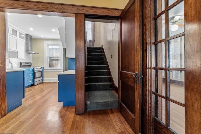 staircase with light wood-type flooring