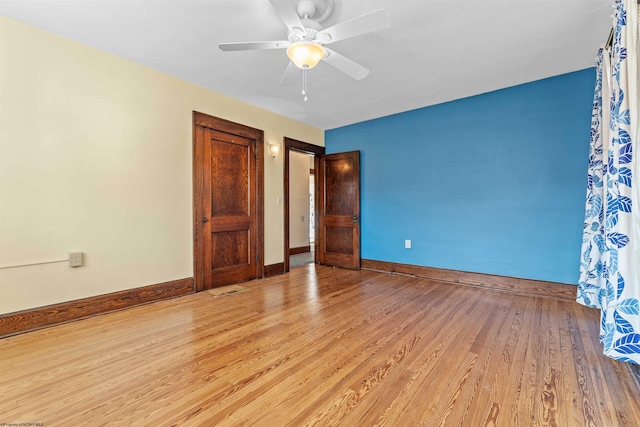 unfurnished bedroom with light hardwood / wood-style flooring and ceiling fan