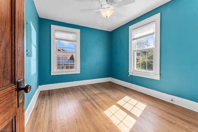 unfurnished room featuring ceiling fan and light hardwood / wood-style flooring