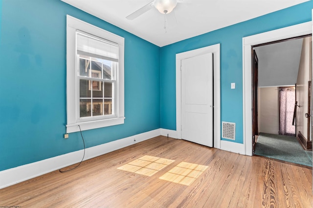 unfurnished bedroom with light hardwood / wood-style floors and ceiling fan