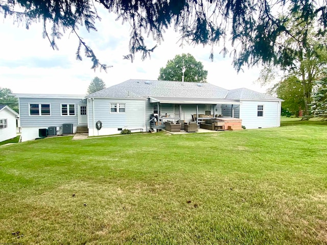 rear view of house with a patio, central AC, a lawn, and outdoor lounge area