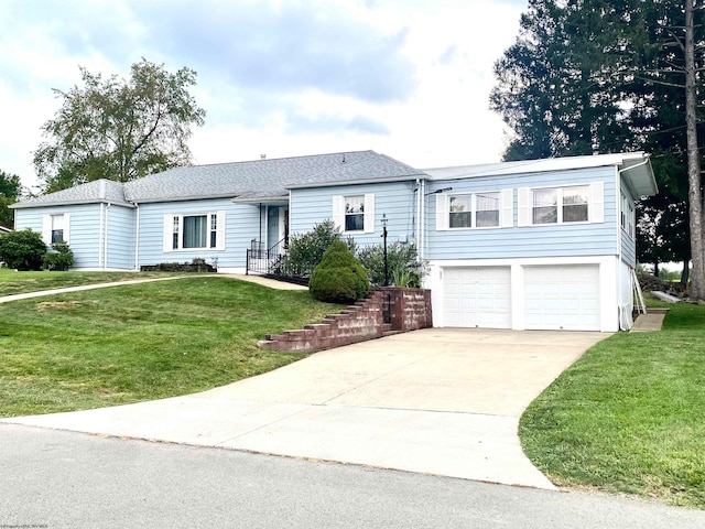 view of front of home featuring a garage and a front lawn