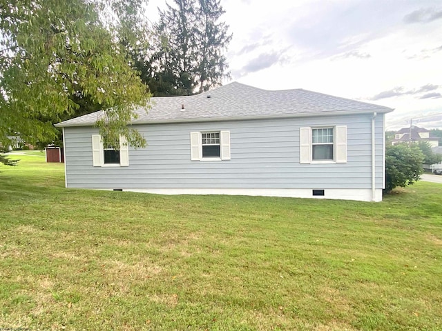 rear view of house with a yard