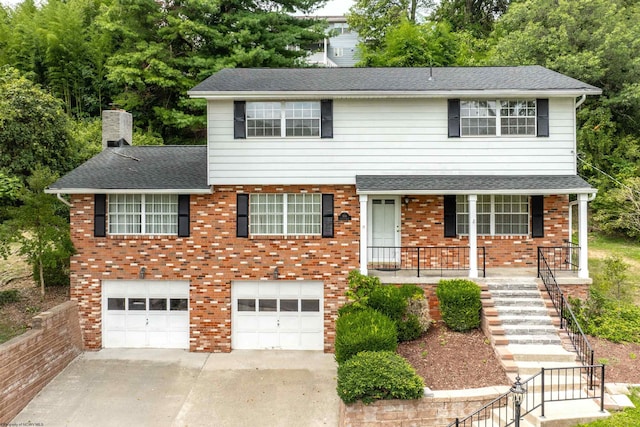 view of front of house with a porch and a garage