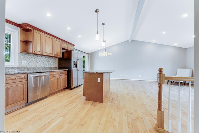 kitchen featuring light hardwood / wood-style flooring, backsplash, a kitchen island, stainless steel appliances, and hanging light fixtures