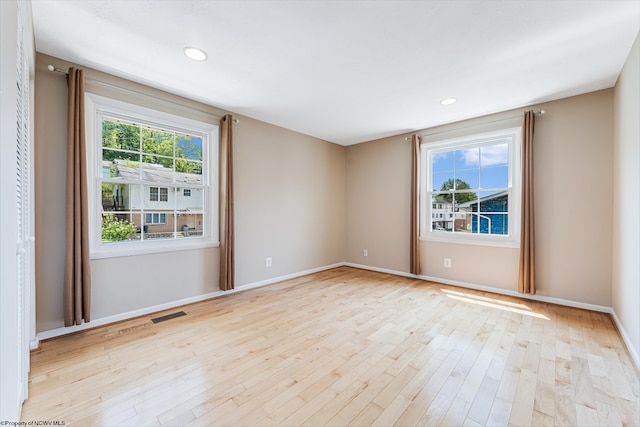 empty room with light wood-type flooring