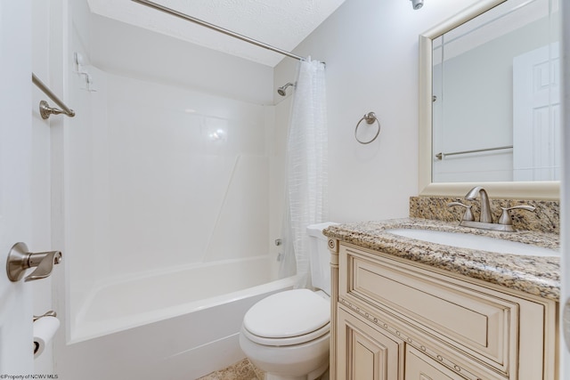 full bathroom featuring shower / bath combination with curtain, toilet, vanity, and a textured ceiling