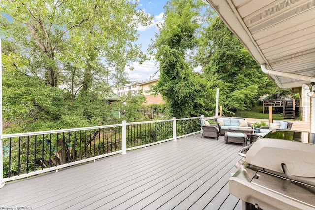 wooden terrace featuring an outdoor living space