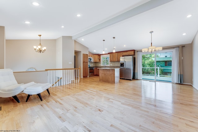 kitchen with appliances with stainless steel finishes, light hardwood / wood-style flooring, tasteful backsplash, and vaulted ceiling with beams