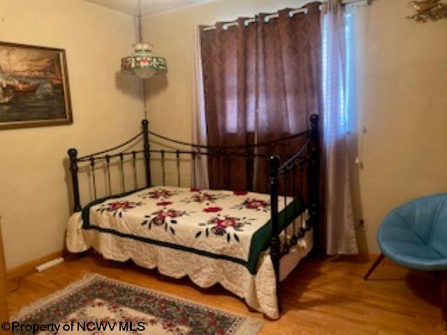 bedroom featuring wood-type flooring