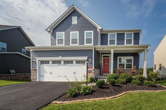 view of front of property with a garage and a porch