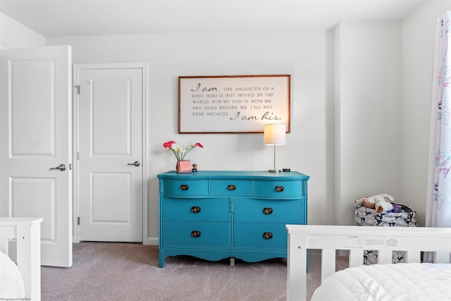 bedroom featuring light carpet