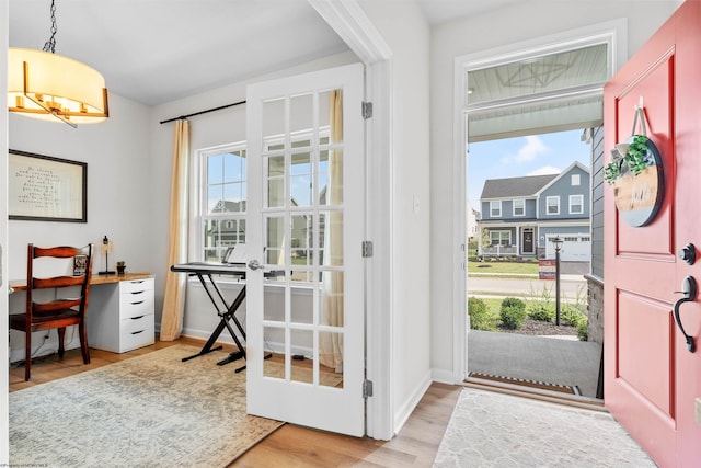 entryway with light hardwood / wood-style flooring