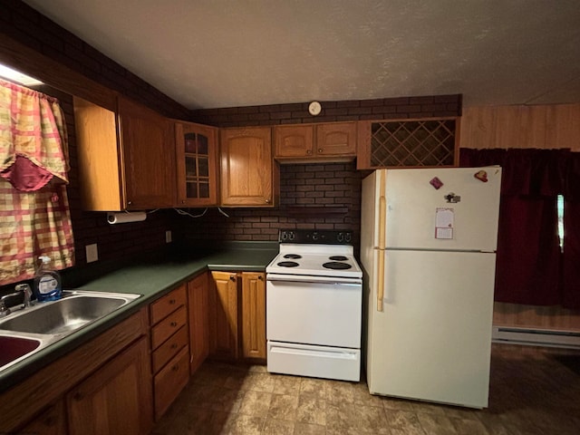 kitchen with a baseboard radiator, light tile patterned floors, backsplash, white appliances, and sink