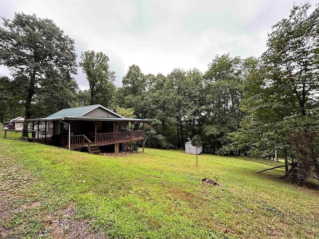 view of yard with a wooden deck