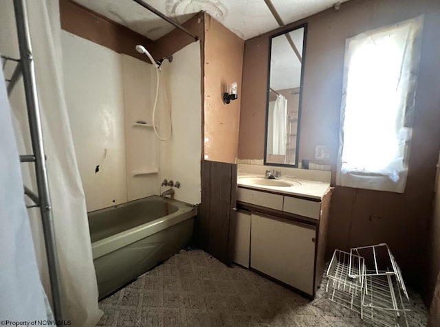 bathroom featuring vanity and bathing tub / shower combination