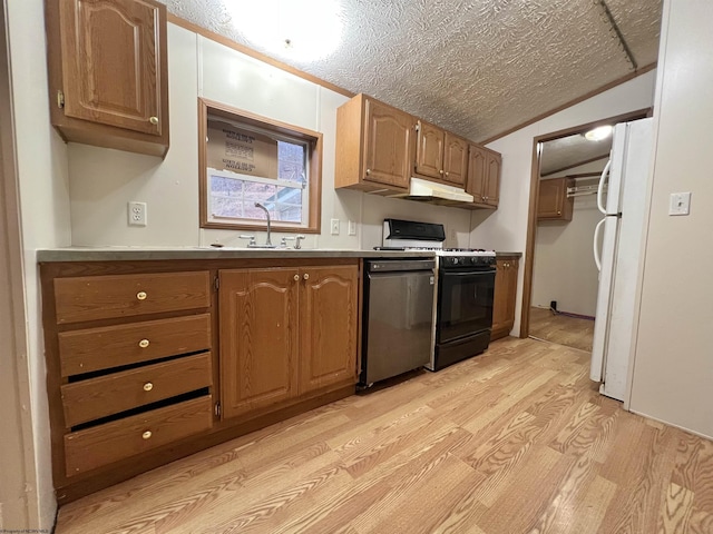 kitchen with gas range, a textured ceiling, black dishwasher, white fridge, and light hardwood / wood-style floors