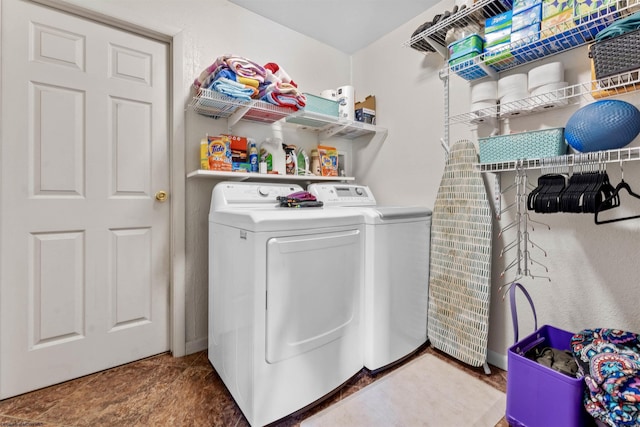 laundry room with laundry area and washing machine and clothes dryer