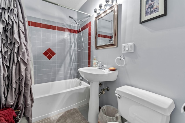 bathroom featuring toilet and shower / tub combo with curtain